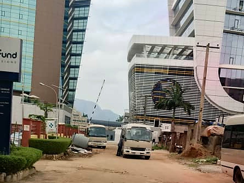 Buses waiting for staff outside corporate offices in Abuja